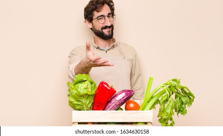 green grocery man smiling, looking happy, confident and friendly, offering a handshake to close a deal, cooperating - Powered by Shutterstock