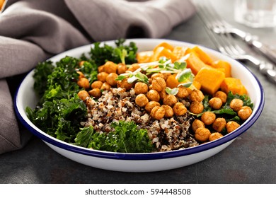 Green And Healthy Vegan Grain Bowl With Quinoa, Butternut Squash, Kale And Roasted Chickpeas