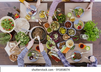 Green healthy vegetarian food for lunch with friends - Shutterstock ID 591858074