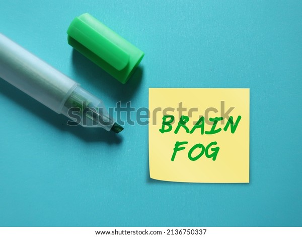 Green\
highlight pen write on stick note BRAIN FOG, a term used to\
describe feelings of mental fuzziness, inability to think clearly,\
occurs when the brain is overworked or under\
strain