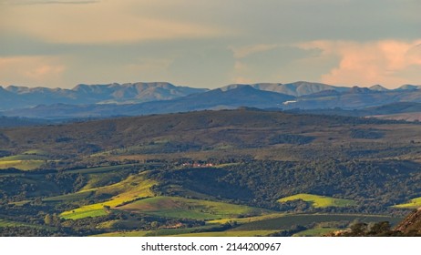 Green Hills Covered By A Fine Mist And In The Background Mountains Of The  Bocaina Montain Range.