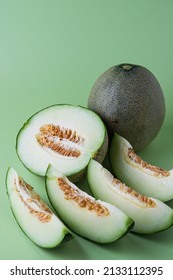 Green Honeydew Melon Fruit With Solid Green Background