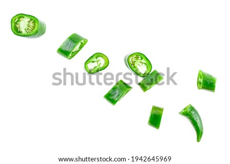 Green hot chili pepper slices isolated on a white background. Sliced jalapeno peppers.