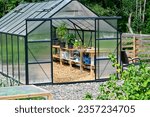 Green house in cultivating area in garden