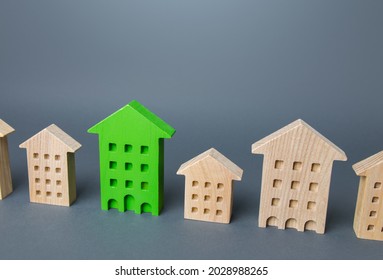 Green House In A Row Of Houses. Search For The Best Option To Buy An Apartment. High Quality Modern Housing. Environmentally Friendly, Energy Efficient And Zero Carbon Emissions. Carbon Neutrality.