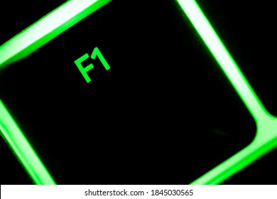 Green Illuminated Keyboard F1 Key Closeup