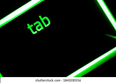 Green Illuminated Keyboard Tab Key Closeup