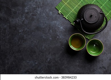 Green japanese tea on stone table. Top view with copy space