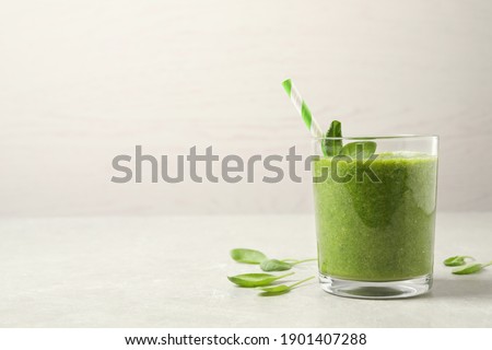 Similar – Foto Bild Grünkohl Smoothie im Glas auf weißem Holzgrund.