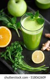 Green Juice Made From Parsley, Mint, Orange, Lemon, And Ginger