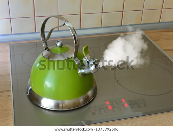 green kettle boils thick\
steam