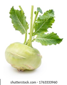 Green kohlrabi with green leaves on isolated white background.