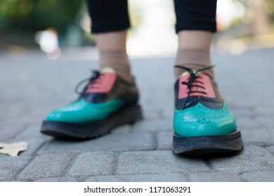 Green lacquered oxford shoes . Top view. Close up. hipster woman wear fashion shoes tassel loafer