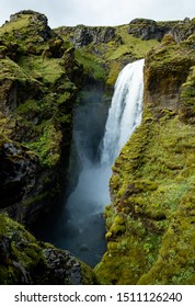 Green landscape and waterfall hidden in the highlands of Southern Iceland