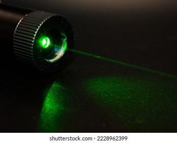 Green laser pointer. High power laser pointer use of lighting in the sky