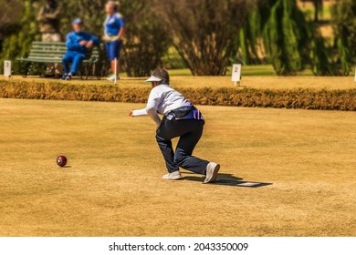 Green Lawn Bowling Female Player Throwing Ball