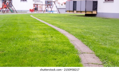 Green Lawn, A View Of The Playground, A Beautiful Area Near The Apartment Building. Banner