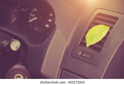 Green Leaf In The Car Air. Clean Air Conditioning.Health-care Concept.
