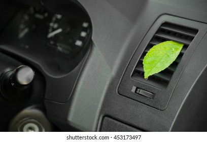 Green Leaf In The Car Air. Clean Air Conditioning.Health-care Concept.