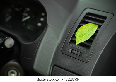 Green Leaf In The Car Air. Clean Air Conditioning.Health-care Concept.