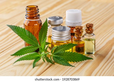 Green leaves of medicinal cannabis with extract oil.Medical marijuana flower buds. Hemp buds - medical marijuana concept