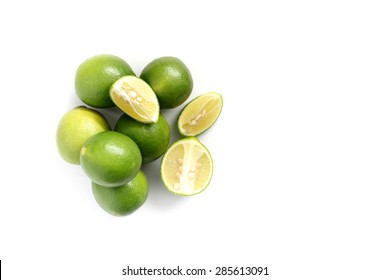 Green lemons on white background - Shutterstock ID 285613091