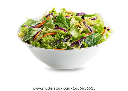 Green lettuce salad with fresh mixed vegetables isolated on white background