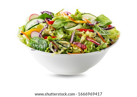 Green lettuce salad with fresh vegetables isolated on white background