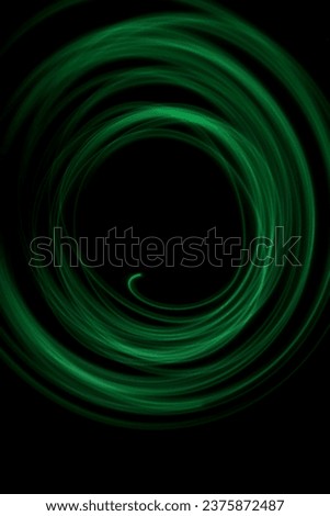 Green light circle, green swirl made with long exposure technique photography, no people, green light line art