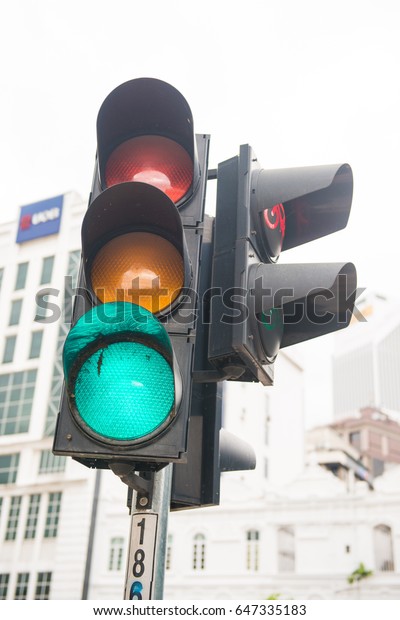 green light
on traffic light at intersection ,
road