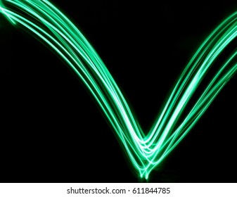 Green Light Painting Photography V Shape On A Black Background