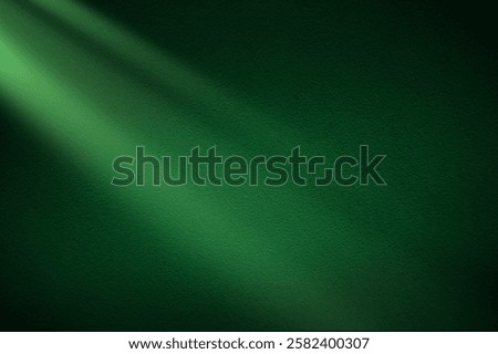 Green light rays on dark green background. Abstract green light background. St Patrick's Day banner design. 