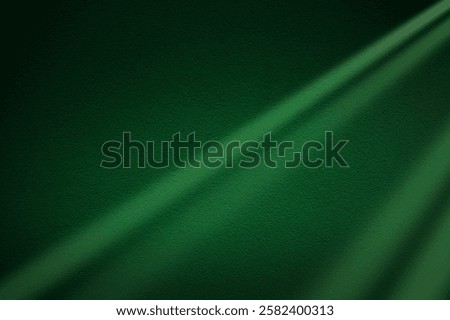 Green light rays on dark green background. Abstract green light background. St Patrick's Day banner design. 