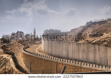 Green Line concrete wall separating Israel and Palestine. Security wall also known as West Bank Barrier. Outskirts of Jerusalem.