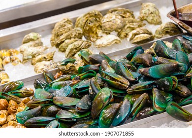 Green Lipped Mussels And Oysters For Sale At A Fishmonger Wet Market Stall, Phuket, Thailand