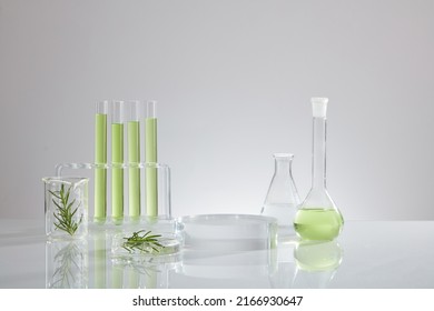 Green liquid extract from green leaf , research for develope decorated with transparent podium with laboratory equipment , chemistry research content - Shutterstock ID 2166930647