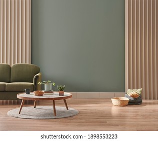 Green living room wall background with grey decorative chair, lamp frame middle table and poster style.