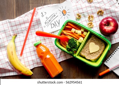 Green Lunch Box For Kid On Wooden Background Top View