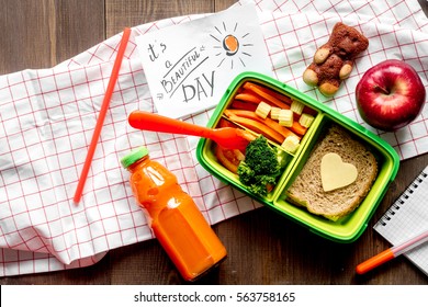 Green Lunch Box For Kid On Wooden Background Top View