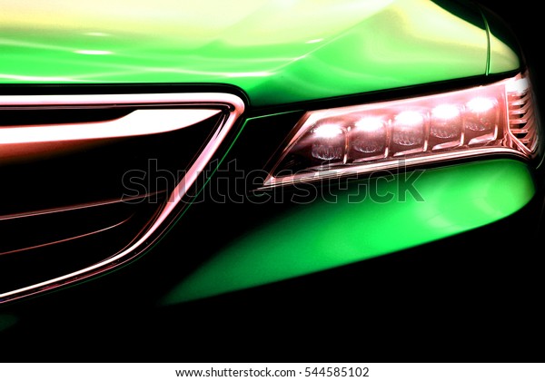 Green Luxury\
Sports Car Front Hood Light Close\
Up
