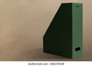 Green Magazine Holder On Brown Background