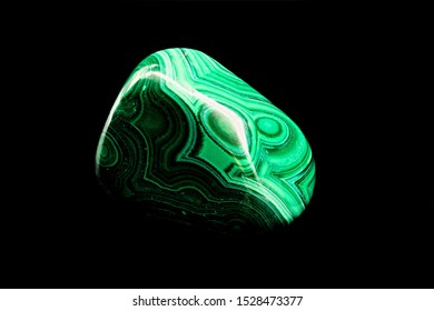 Green Malachite Raw Stone Specimen Against A Black Limbo Background