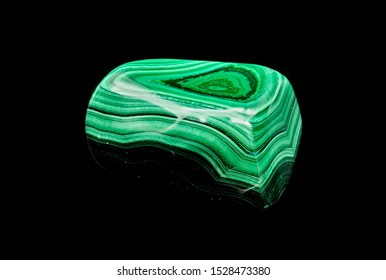 Green Malachite Raw Stone Specimen Against A Black Limbo Background