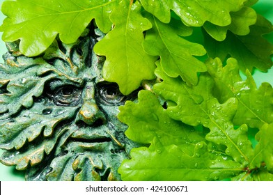 Green Man Pagan Icon And Oak Leaves, Close Up Image.