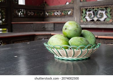 green mangoes in the basket