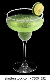 Green Margarita In Front Of A Black Background With Fresh Garnish