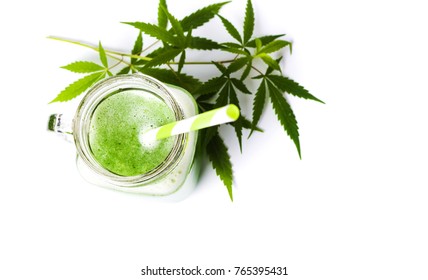 Green marijuana smoothie juice on white background