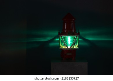 Green Marine Light Glows In A Dark, Close Up Photo