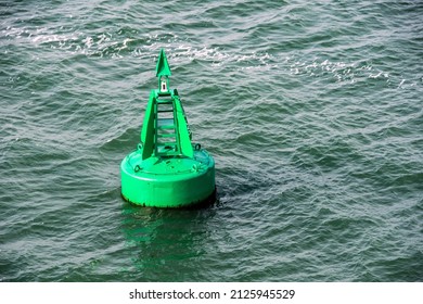 A Green Marker Buoy In Southampton Water, UK.