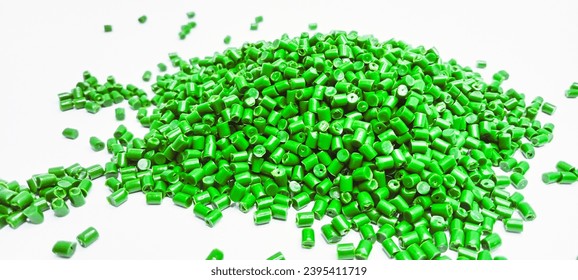 Green masterbatch polymer granules isolated on a white background are suitable for banner designs for product profile photos in industrial plastic company catalogues